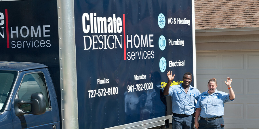 Climate Design team waving by service truck